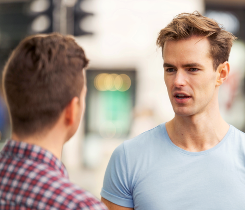 man talking to a friend